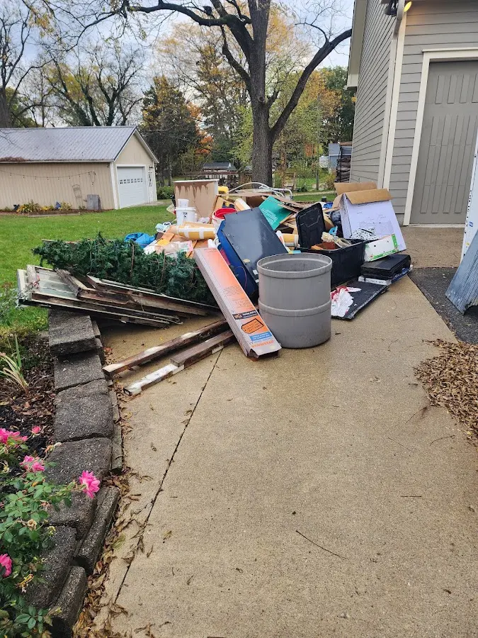 Dumpster being loaded with debris for 10 Yard Dumpster Rental in Greenbrier